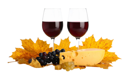 Two glasses of red wine with cheese, grapes and autumn leaves on transparent background