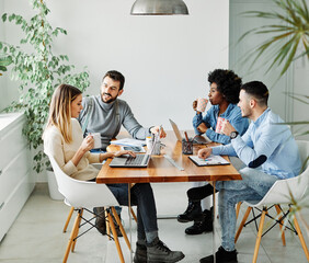 Group of young business people using laptop having a meeting or presentation and seminar in the office