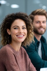 Diverse coworkers smiling during brainstorming session in modern office, showcasing collaboration and creativity in an inclusive business environment with copy space