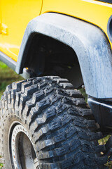 Off road tire of a yellow car