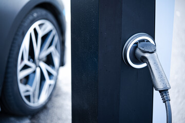 Electric car plugged in for charging