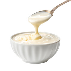 Delicious creamy sauce pouring from spoon into elegant white bowl, perfect for desserts