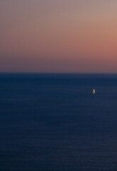 Pastel boat at sunset