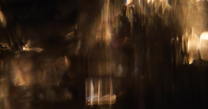 Abstract blurred light leaks on dark background with copy space. Studio anamorphic lens flare bokeh effect for title or logo display. - Powered by Adobe