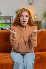 Young redhead woman feeling hopelessness and loneliness, nervous breakdown, loses play game...