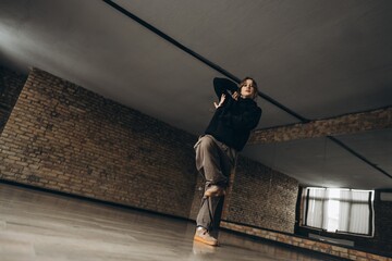 Dancer performs in an urban studio setting during a practice session