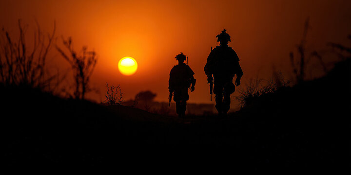 “Soldiers Silhouette Behind Barbed Wire at Sunset, War and Conflict Concept” - Powered by Adobe