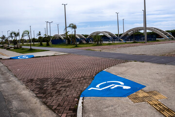 Accessible sidewalk with ramp and signage for people with disabilities (PWD). Illustrates inclusion...