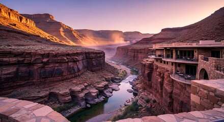 Fototapeta premium Canyon Serenity: Cliffside Architecture at Sunset with River Mist