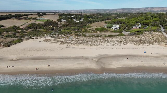 Port Willunga Beach, South Australia &ndash; 4K Aerial Drone Footage of Australia Beach, Historic Jetty Ruins, Limestone Cliffs, Golden Sand, Clear Blue Ocean Coastline, and Coastal Houses