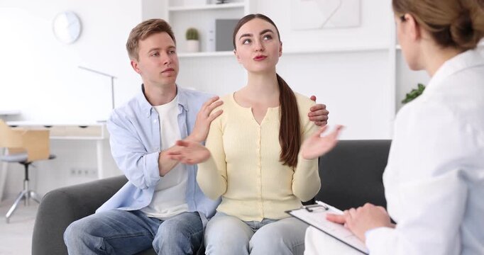 In vitro fertilization (IVF). Couple having appointment with doctor in reproductive clinic