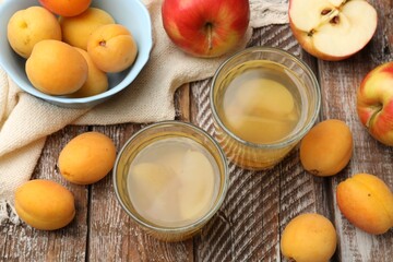 Tasty compot and fruits on wooden table, flat lay