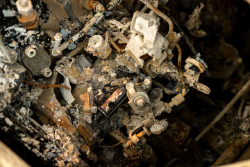 The Aftermath of a Car Fire with a Destroyed Motor. Concept The forensic details of a disaster.