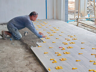 Construction process of laying floor tiles.