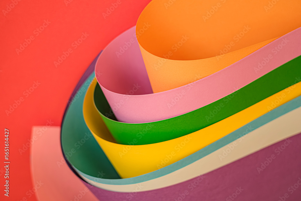 Aufkleber vibrant abstract composition of rolled and layered colored papers in a spectrum of hues, creating dy