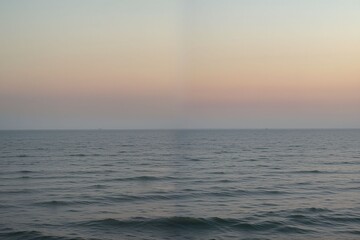 Fototapeta premium Serene Ocean View at Dusk with Soft Color Gradients in Sky