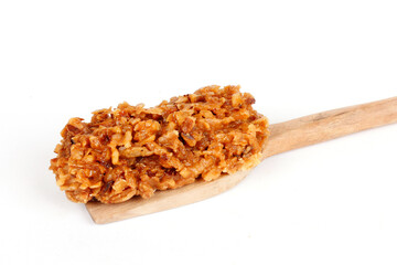 Brazilian brown cocada, coconut candy, a traditional homemade treat very common in Brazil. Isolated...