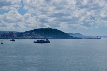Fototapeta premium Crane Barge Near Harbor Headland