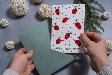 Reindeer fingerprints Unrecognizable woman preparing craft Christmas greeting card holiday present....