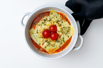 Gourmet 'Quesaña,' a creative no-pasta lasagna made with layers of melted cheese instead of pasta,...