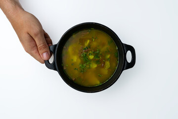 Traditional Colombian soup (Caldo), such as Caldo de Costilla or Ajiaco, a hearty homemade beef and...