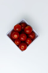 Fresh Cherry Tomatoes in White Bowl on White Background – Healthy Food Concept