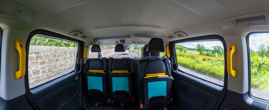 UK, Scotland Edinburgh hackney carriage taxi cab riding in historic city center