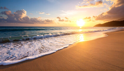 Golden Hour Beach Scene with Gentle Waves and Sparkling Sunlight on Wet Sand