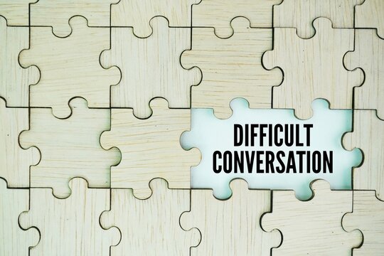 Wooden puzzle with stick with the word DIFFICULT CONVERSATION. difficult concept of conversation