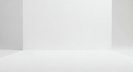 Obraz premium Minimalist white studio room background with ample Copy Space for product display and presentation.