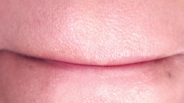 Close up Macro of Indian teenage girl lips doing various types of expressions. lift, Frown, grimace, moue, scowl, pout, Kiss, smooch, smack, peck, graze, caress, skim