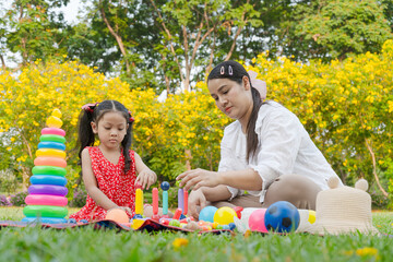 Mom and Thai daughter do activities for the model.