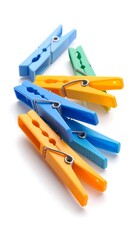 Colorful plastic clothespins arranged on white background