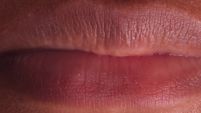 Close up Macro of Indian teenage girl lips doing various types of expressions. lift, Frown, grimace, moue, scowl, pout, Kiss, smooch, smack, peck, graze, caress, skim