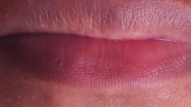 Close up Macro of Indian teenage girl lips doing various types of expressions. lift, Frown, grimace, moue, scowl, pout, Kiss, smooch, smack, peck, graze, caress, skim