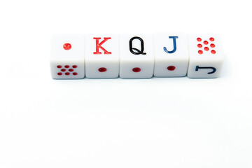 Four white dice forming the poker hand king, queen, jack, lying on a white background, ideal for gambling or casino concepts