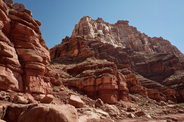 Fototapeta premium Desert canyon with layered red rock formations 