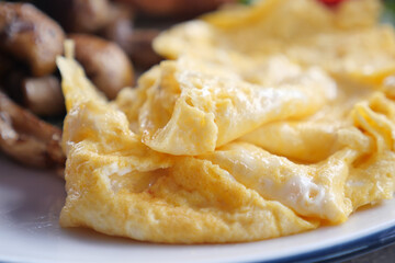 Delicious fluffy omelet served with mushrooms