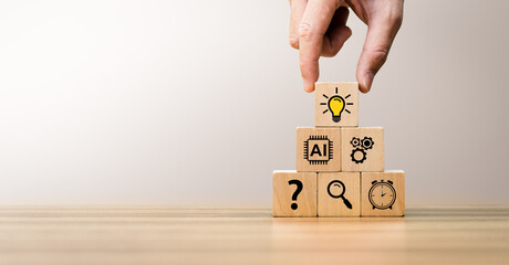 Artificial intelligence and creative problem solving concept with hand stacking wooden blocks...