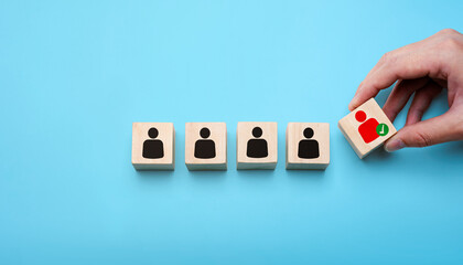 Human resources recruitment concept with hand selecting the best candidate from a lineup of people...
