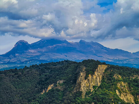 iztaccihuatl mountain landscape with blue sky and clouds - Powered by Adobe