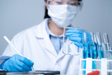 Professional healthcare medical worker doctor working for new discovery of medicine to treat...