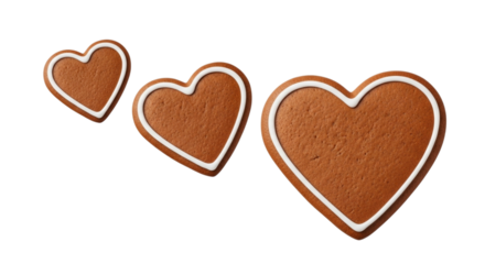 Three gingerbread heart cookies in different sizes with white icing, isolated on white and transparent background for holiday and food concepts