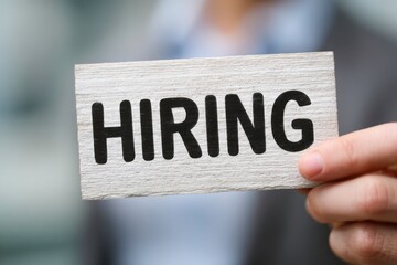 hand holding a word hiring