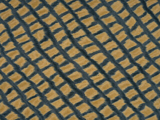 Golden yellow diamonds with deep teal contours on a plush veneer texture
