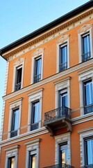 Obraz premium Ornate orange building facade with many windows