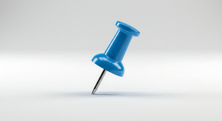 A single blue pushpin or thumbtack isolated on a plain white background. Office stationery concept for pinning reminders and important notes.