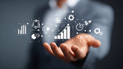 Technology and data analysis tools held in hand representing business growth and innovation ideas in a modern workspace environment