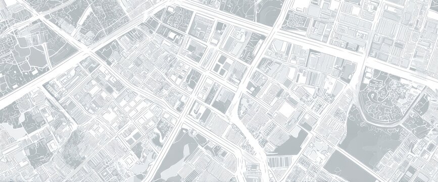 High-angle view of a city's street layout.  Detailed map showing city blocks, roads, and various land use areas in light grayscale