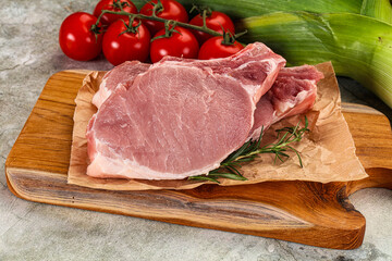 Raw pork steak loin with bone
